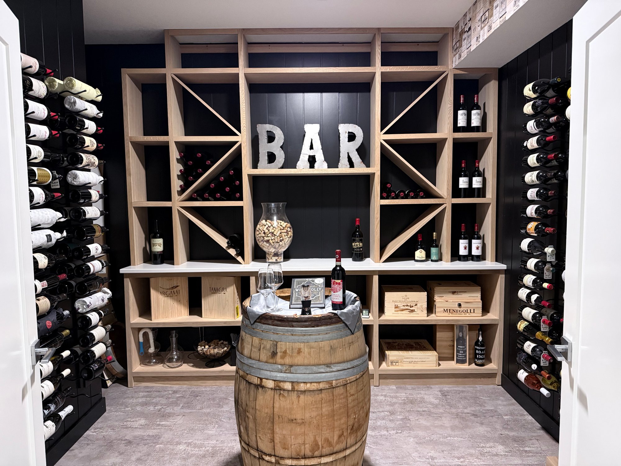 Custom wooden wine storage with individual bottle slots and diamond rack storage display in residential wine room